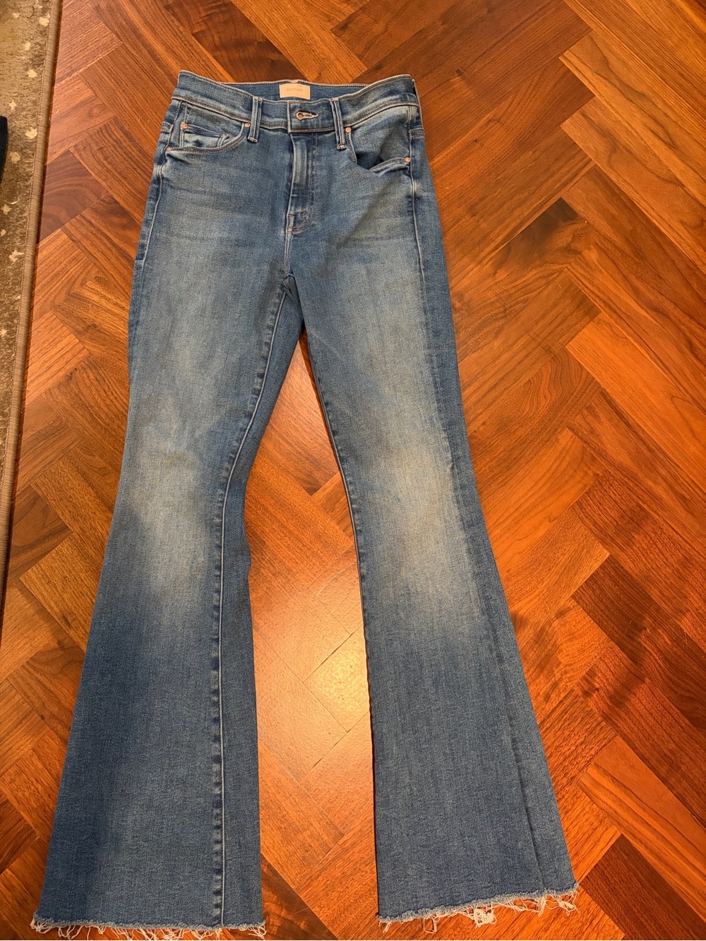 MOTHER Light Blue High-Rise Flare Jeans with Frayed Hem